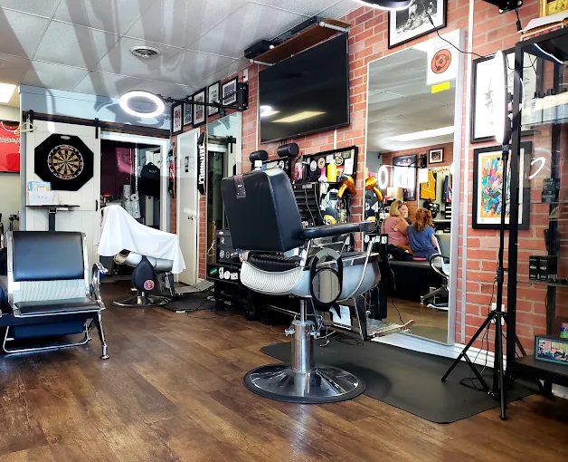 Barber chairs and brick walls inside Faded Barber Shop in Rehoboth Beach