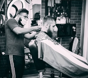 Beard trim and line-up in progress at Faded Barber Shop